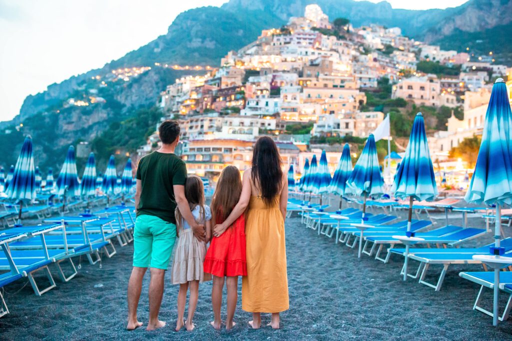 family in front of positano on the amalfi coast in 2023 11 27 04 52 20 utc min