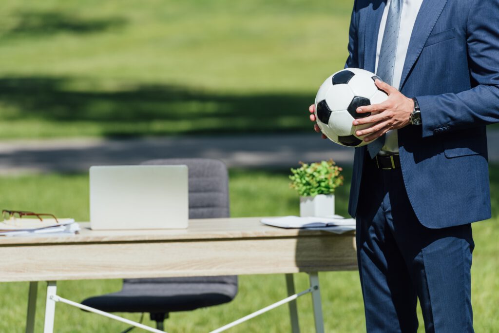 cropped view of businessman holding soccer ball wh 2023 11 27 05 11 41 utc